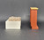 Fisher-Price doll house decorator set #254 Chair and Fireplace.  The chair and fireplace set includes a plastic fireplace and FPT5022 white plastic square chair with tan stuffed fabric cushion that fits the chair with muli-colored flowers.