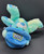 Hershey's Chocolate World Jolly Rancher blue tie-dye pattern teddy bear that is 10-inches tall. The bear is wearing a blue hat with Jolly Rancher on the front and his left foot has Jolly Rancher embroidered on it. The Hershey Company acquired the brand in 1996.