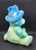 Hershey's Chocolate World Jolly Rancher blue tie-dye pattern teddy bear that is 10-inches tall. The bear is wearing a blue hat with Jolly Rancher on the front and his left foot has Jolly Rancher embroidered on it. The Hershey Company acquired the brand in 1996.