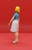 Vintage Fisher-Price #250 Doll House Mom figure. The mom figure is wearing light blue short sleeve shirt, white skirt and white shoes. This was available 1978 only.