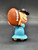 Peanuts Gang 2.25-inch tall mini figure of Lucy Van Pelt holding a football. The mini figures were sold in surprise eggs. Lucille "Lucy" Van Pelt is a fictional character in the syndicated comic strip Peanuts, written and drawn by Charles Schulz. She is the older sister of Linus and Rerun.