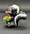Disney's Flower the Skunk holding flowers 2.25-inch tall PVC figure for ages 3+. Flower is a major character in Disney's 1942 animated feature film Bambi. He is a bashful, soft-spoken skunk who is mistakenly identified as a "flower" by Bambi, hence his ironic name. The figure was Made in China.