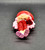 American Greetings Strawberry Shortcake 3-inch tall figure of French Crepe Suzette. In 2003, Crepes Suzette became a fair-skinned girl and has purple eyes and straight, long pastel pink hair. She wears a red beret with a purple ribbon around it and a cherry. Her outfit consists of a white t-shirt with a purple collar with a cherry, red jeans with a purple cuff, and purple flats with red bows.