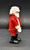 Geobra the German manufacture of Playmobil 1986 Santa Claus 3-inch tall figure for ages 3+. The figure is wearing a red Santa suit and black boots and belt. Santa is missing his hat and accessories.