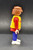Geobra the German manufacture of Playmobil 1992 Headphone wearing Crew Member from 3091 Formula One Pit Crew Team 3-inch tall figure for ages 3+. The figure is wearing a red shirt with yellow jacket and blue pants. The crew member is missing his hat and headphones.