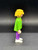 Geobra the German manufacture of Playmobil 1992 White basketball player (part #3000650) from 3867 Street Hoops Set 3-inch tall figure for ages 3+. The figure is wearing a green shirt with basketball in net and purple pants. The figure is missing his hat (part #3006669).