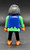 Geobra the German manufacture of Playmobil 2002 pirate figure (part #3009530) from 3127 Pirates Superset 3-inch tall figure for ages 3+. The figure is wearing a green shirt with blue vest and black pants. The figure is missing his red headband (part #30096640).