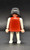 Geobra the German manufacture of Playmobil 1974 female Indian 3-inch tall figure for ages 4+. The figure is wearing a red top and white shirt and pants. The figure is missing headpiece.
