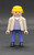 Geobra the German manufacture of Playmobil City Life School Bus Driver 3-inch tall figure for ages 4+ from the 6866 City Life set. The figure is wearing a plaid shirt, grey jacket, blue pants and has blonde hair. The bus driver is missing his red hat.