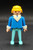 Geobra the German manufacture of Playmobil 1974 Policeman 3-inch tall figure for ages 4+. The figure is wearing dark blue shirt with white collar  and light blue pants. The policeman is missing his helmet and accessories.