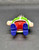 Geobra the German manufacture of Playmobil 1992 white male with mustache 3-inch tall figure for ages 4+. The figure is wearing a red pants, purple boots, white shirt and green vest. Figure is missing his hat and accessories.
