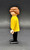 Geobra the German manufacture of Playmobil 1974 Male with brown hair 3-inch tall figure for ages 4+. The figure is wearing a yellow shirt and black pants and shoes. The figure is missing his hat and accessories.
