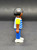 Geobra the German manufacture of Playmobil City Life School Bus black student 2-inch tall figure for ages 4+ from the 5940 City Life School Bus set. The figure is wearing a blue/grey striped shirt with yellow sleeves, blue pants and has black hair.