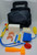 Fisher-Price Medical Kit #72010 playset. The new medical set includes a black doctor bag, a box of pretend bandages, a pretend cast, a thermometer, blood pressure cuff and more, all of which fit neatly inside the medical bag! Some of the pieces used in this set are carry-overs from the #936 Medical kit, but the bandage box, band-aids, pretend cast, and the medical bag are all new to this set. Designed for children ages 3 to 7 years old.