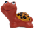 Vintage red-orange ceramic turtle figurine with smiling face and yellow spotted shell