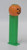 PEZ - Pumpkin (Version B) Dispenser, plastic Halloween-themed pumpkin candy dispenser with a jack-o'-lantern face and green base.