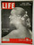 LIFE magazine, October 30, 1950 cover featuring a black and white profile portrait of a smiling woman with flowers in her hair, wearing a pearl necklace, and with a ribbon tied in her hair, with headlines about Churchill, Stalin, and Faye Emerson.