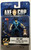 Axe Cop Action Figure, toy police officer with sunglasses, police badge, axe, unibaby, lemon grenade, and poop-sucker gun in packaging.