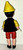Madame Alexander McDonald's Happy Meal Toy- Madame Alexander Disney's Pinocchio Toy Figure, back view of Pinocchio with yellow hat, black vest, red shorts, and brown shoes.