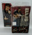 McFarlane Toys Elvis Presley '68 Comeback Special Action Figure with Damaged Package, detailed collectible figurine of Elvis Presley singing and playing guitar, in original box with packaging.