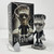 Retro-a-go-go! Midnight Movie Lil' Frankie Tiny Terror, collectible vinyl figure of a zombie with a square head, wearing a black jacket and earrings, standing next to its box with ghoulish artwork.