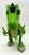 Hasbro Playskool Heroes Jurassic World T-Rex Figure, green dinosaur toy with detailed scales, open mouth, and movable limbs for children.