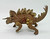 Hasbro Jurassic World Bashers & Biters Stegosaurus Figure, detailed plastic toy dinosaur with realistic textures, movable tail, and armor, designed for children and collectors.