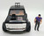 Kenner M.A.S.K. Cliff "Blaster" Dagger With Truck, toy action figure and vehicle in black with detail, includes a miniature figure of Cliff Dagger in purple attire standing next to the vehicle.
