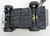 Kenner M.A.S.K. Cliff “Blaster” Dagger With Truck, toy vehicle viewed from underneath showing wheels and chassis on a white background.