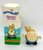 AVON Somersaults Charley Harley Mini Doll, toy figurine with a round face, blonde hair styled in a wave, wearing blue overalls, and standing with arms outstretched.
