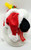 Hallmark Peanuts Hallmark Swingin With Snoopy Toy, festive plush Snoopy wearing a Christmas hat and scarf with a yellow Woodstock figure on top of his head.