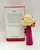 Hallmark Keepsake Ornament Dream Date Barbie, detailed doll figurine with voluminous blonde curly hair in a pink gown with a large bow, next to its original packaging describing the importance of keepsakes.