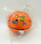 Kellogg's Part Of The Game Mini-Basketball, orange mini basketball with cartoon characters and stars, wrapped in clear plastic.