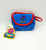 The Lyons Group Vintage 1992 Barney Change Purse, colorful blue purse with red trim and insert, featuring Barney the Dinosaur dancing among musical notes, with a Barney tag attached.