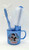 Disney's Snow White Childs Bathroom Set, blue mug with Snow White and the Seven Dwarfs illustration, containing a toothbrush, tongue cleaner, and a hairbrush.