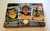 Universal Monsters Universal Studios Monsters Collection Action Figures, featuring Frankenstein, Wolf Man, and Mummy, in collectible packaging with monster images and vintage-style postage stamp designs.