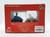 Disney Our Family Tree: Cinderella Mini Snowglobe & Figurine, red box packaging with clear window showing the snowglobe and figurine inside.