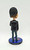MLB Philadelphia Phillies Chase Utley World Series Champions Bobblehead, detailed view of a figurine of Chase Utley with dark hair, dressed in a black blazer, standing on a base commemorating the 2008 World Champions Parade.