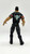 WWE 1999 Dwayne The Rock Johnson Action Figure (Loose), front view of the action figure showing back design with a black jacket featuring a goat face logo with red eyes.