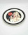 Coca-Cola 8-inch Plate, vintage style plate with a classic Coca-Cola advertisement featuring a smiling woman holding a Coca-Cola bottle.