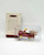 Hallmark Keepsake Ornament: Kiddie Car Classics - Murray Fire Truck, a vintage-style miniature fire truck ornament with a ladder and firefighter helmet.