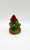Cairn Studio, LTD Tom Clark Gnomes - Alfie (No Box), a ceramic gnome figurine sitting on a tree stump with a red hat, green coat, and brown shoes, designed as a decorative collectible garden ornament.