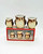 Brinn's Vintage Owl Family Candle Cups, set of three owl-shaped ceramic candle holders with detailed feathers and large eyes, displayed on a red box with owl imagery.
