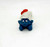 Vintage PEYO 4.0201 Bobsled Smurf PVC Figure, collectible Smurfs toy featuring a blue Smurf with a white helmet and red bobsled, on a plain white background.