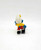 Smurfs Vintage PEYO 4.0205 Skier Smurf PVC Figure, colorful small figurine of a Smurf wearing a yellow jacket, red pants, and black shoes, holding skis.