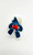 Smurfs Vintage PEYO 4.0215 Windsurfer Smurf PVC Figure, collectible blue Smurf toy with red shorts, lying on a white background.