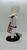Pillsbury Doughboy "Baked to Perfection" Porcelain Doll, a detailed doll resembling a chef with a chef's hat, checkered apron, and holding a tray of baked goods.