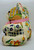 Unbranded Handmade 11 Inch Cross Stitch Teddy Bear, colorful embroidered teddy bear with floral and checkered patterns, pink ribbon around its neck.
