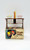 J.S.N.Y. Vintage 1976 Picnic Table Salt & Pepper Shaker Set, retro wooden picnic table with two clear condiment shakers and colorful straws in a plastic bag, original box featured in the image.