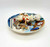 Pillsbury Doughboy 'Poppin' Fresh Barbecups' 3-D Collector Plate, a detailed collectible featuring the Pillsbury Doughboy in a chef's outfit surrounded by miniature cooking and grilling accessories on a decorative oval plate.